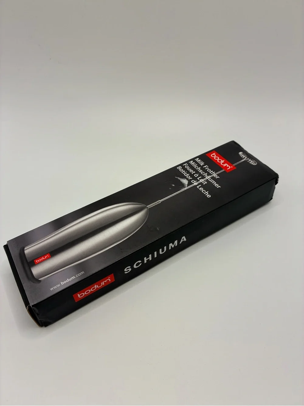Bodum Ergonomic Lightweight Milk Frother in Metallic Silver and Red Detail